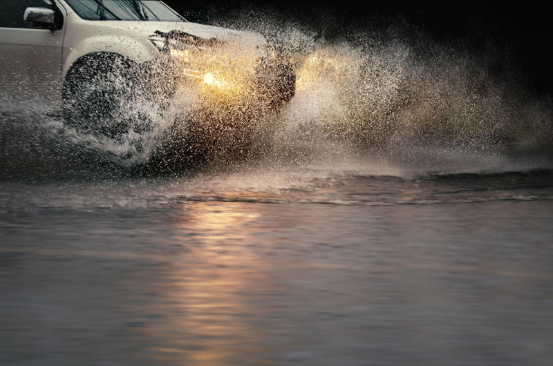 Vehicle driving through flood water
